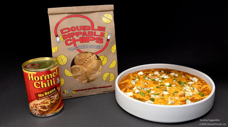 A promotional display of Hormel Chili without beans, a bag of Double Dippable Chips, and a bowl of chili topped with cheese and herbs.