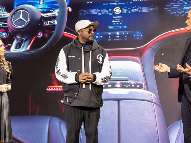 Will.i.am and Mercedes-Benz on stage.
